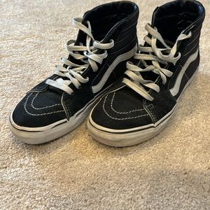 Vans Hightop in Black Suede. They need a little attention with some shoe goo.